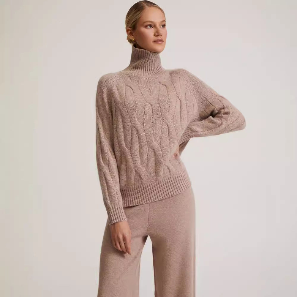 Maglione da donna a collo alto a trecce e pantaloni a gamba larga