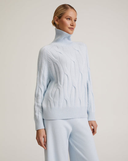 Maglione da donna a collo alto a trecce e pantaloni a gamba larga